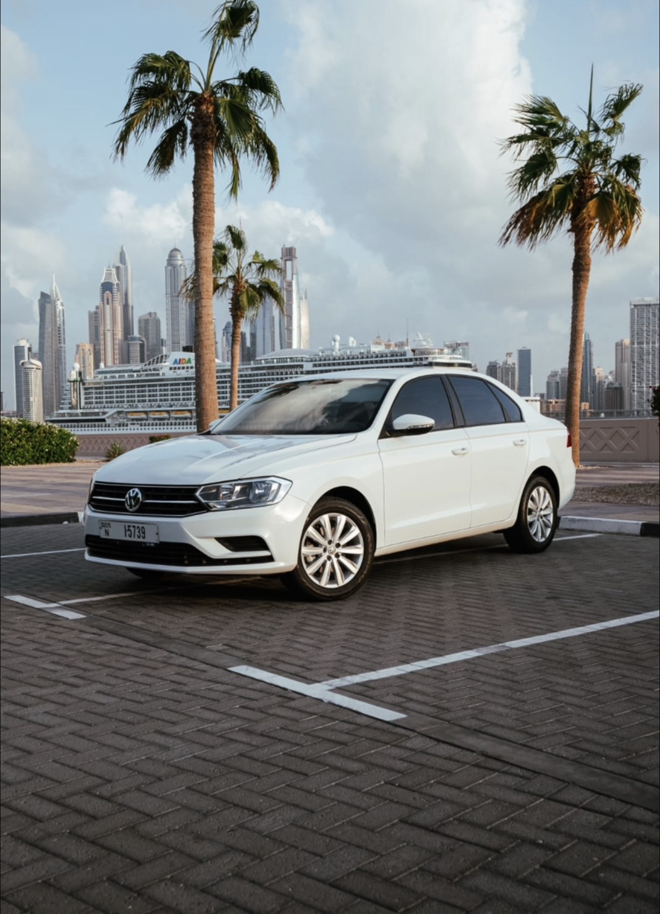 White Volkswagen Bora Sedan with Dubai Skyline